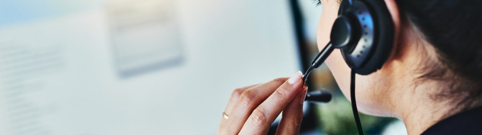 Rearview shot of a young woman working in a call centre